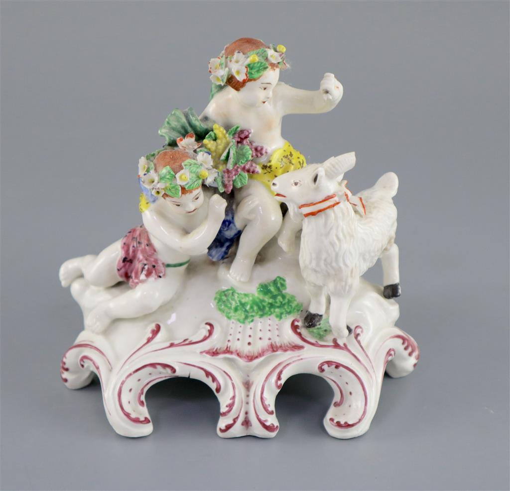 A Vauxhall porcelain group of two Bacchanalian cherubs and a goat, c.1760-5, 14.5cm high